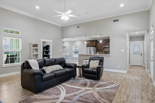 a kitchen with stainless steel appliances granite countertop a refrigerator stove microwave and sink