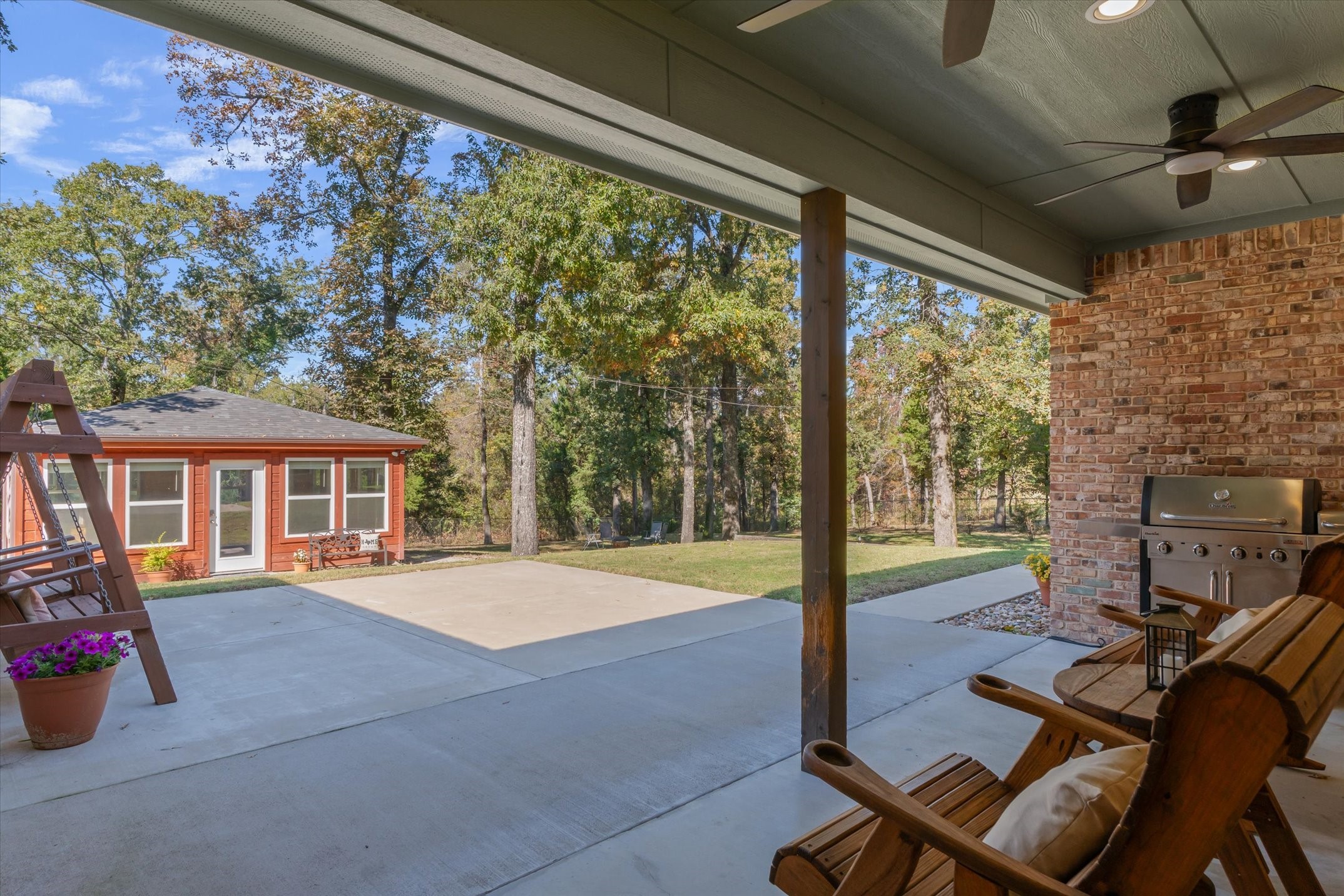 271 Rscr 4269 Emory, TX 75440 - Photo 31 of 48 a view of a patio with table and chairs and floor to ceiling window with wooden floor