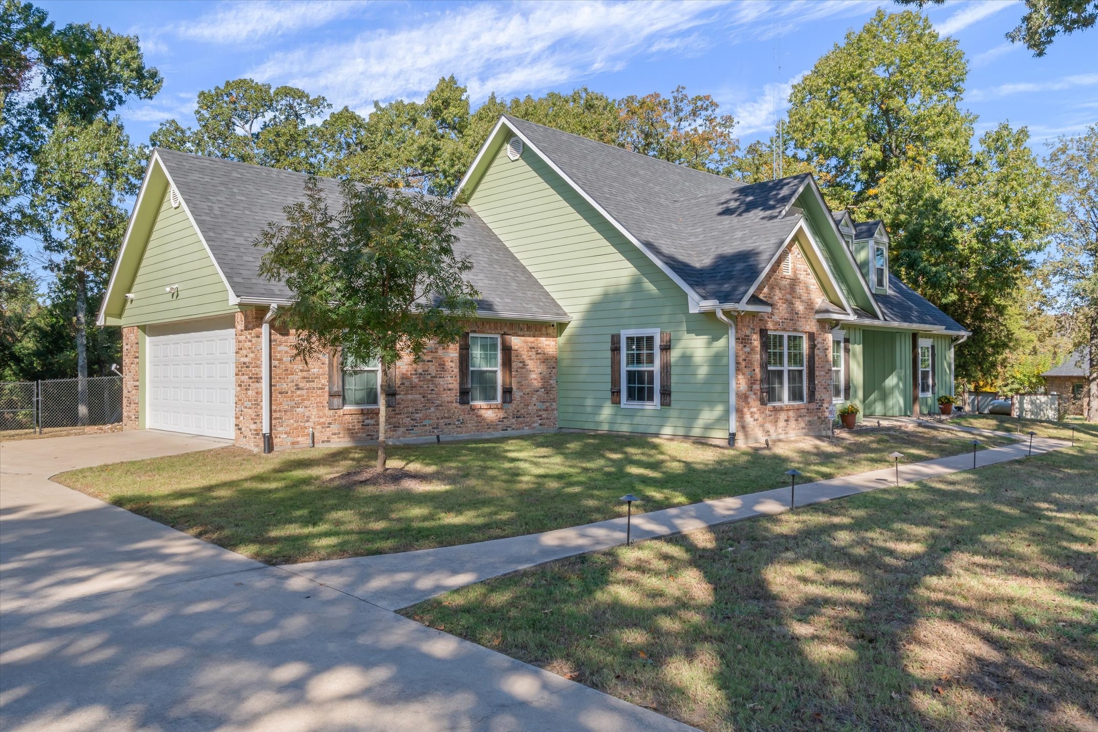 271 Rscr 4269 Emory, TX 75440 - Photo 43 of 48 a front view of a house with a garden