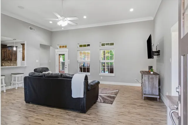 a view of hall way with furniture and windows