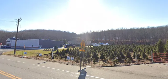a view of a street with a building in the background