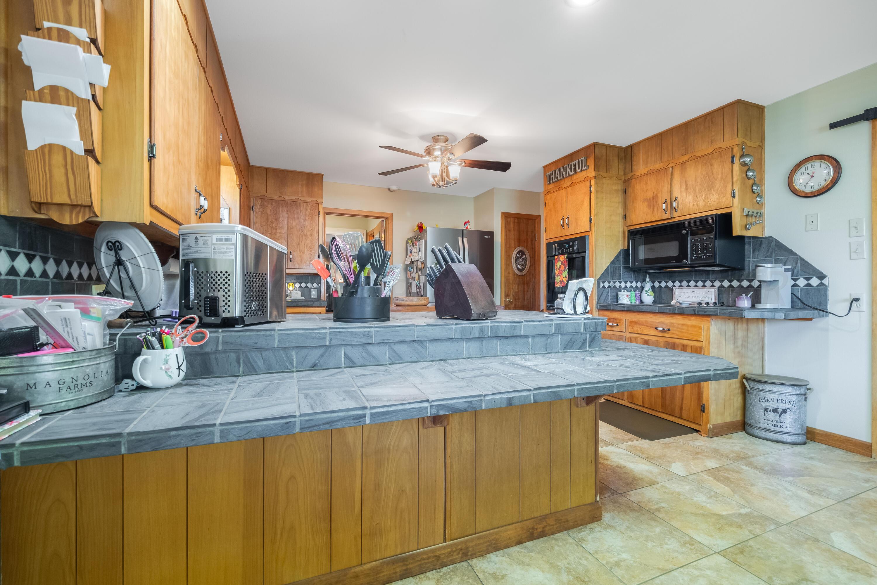 511 Cheyenne Street Wheeler, TX 79096 - Photo 11 of 45 a kitchen with sink and a mirror