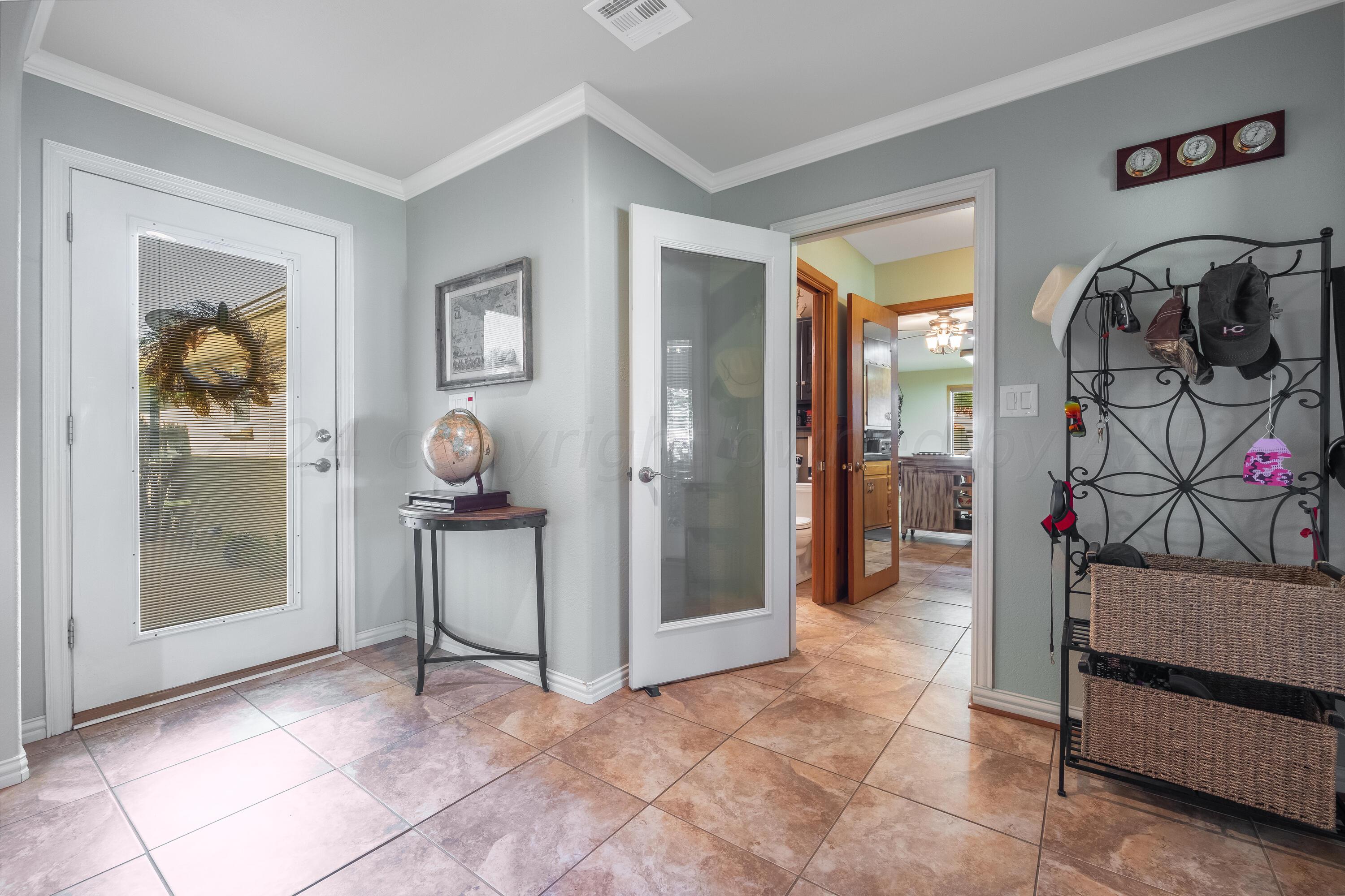 511 Cheyenne Street Wheeler, TX 79096 - Photo 16 of 45 a view of an entryway door and hallway