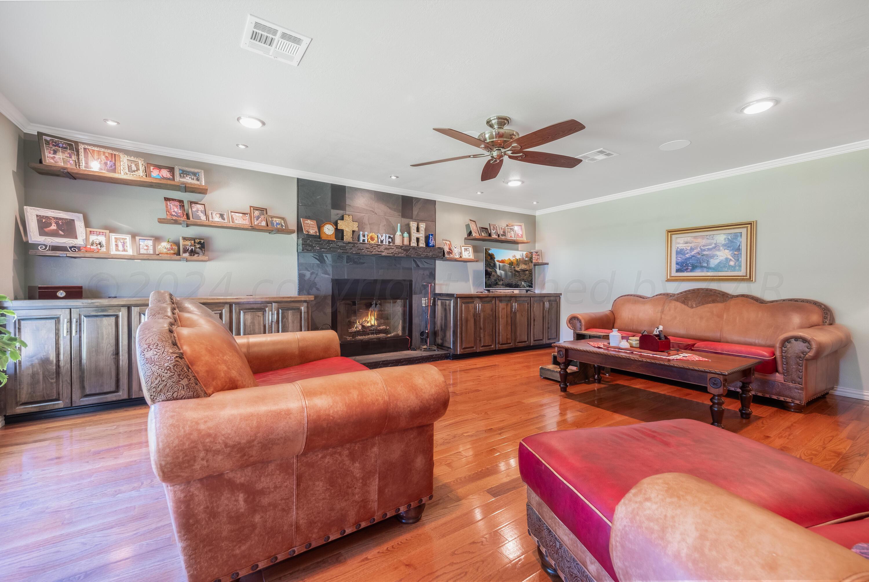 511 Cheyenne Street Wheeler, TX 79096 - Photo 20 of 45 a bedroom with furniture and a fireplace