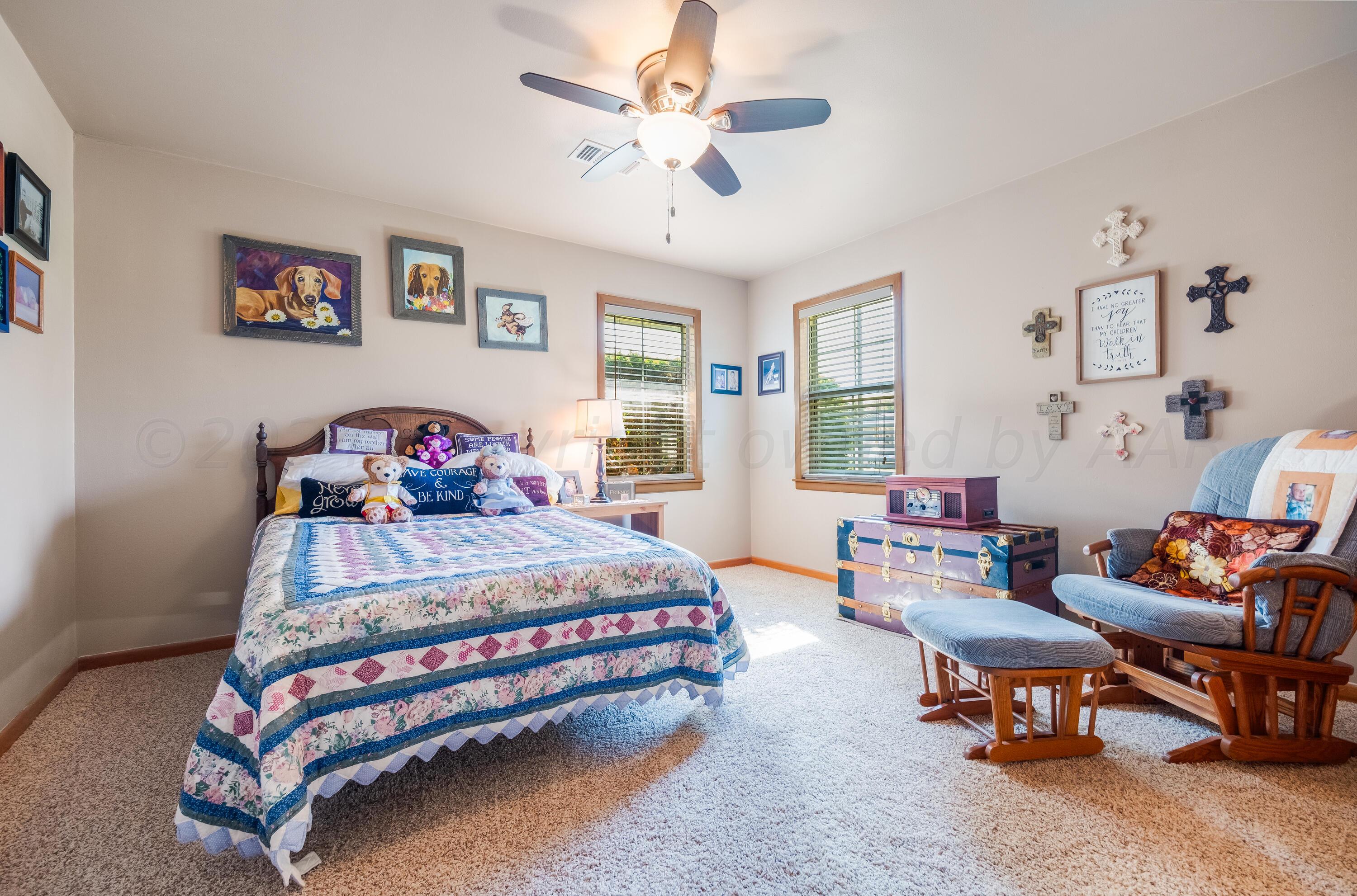 511 Cheyenne Street Wheeler, TX 79096 - Photo 28 of 45 a bedroom with a bed and a couch