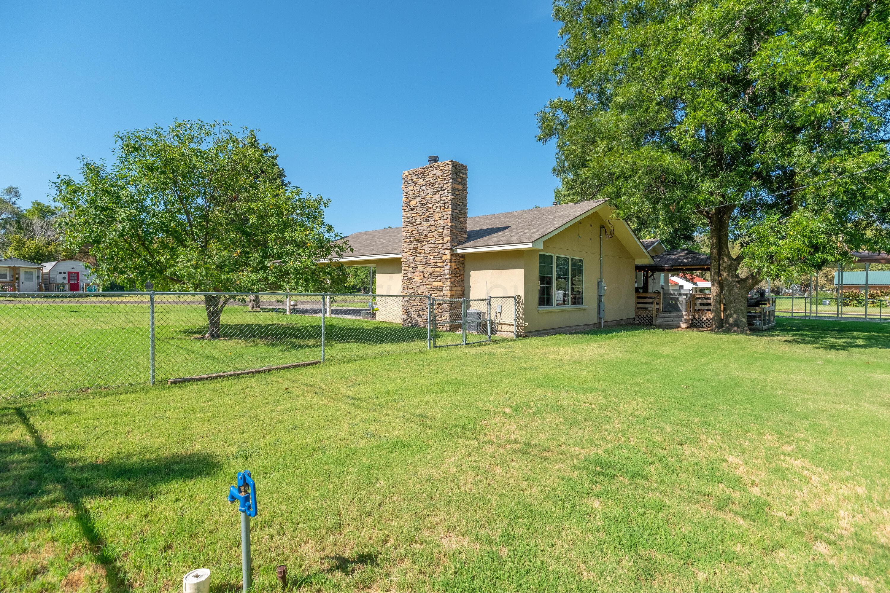 511 Cheyenne Street Wheeler, TX 79096 - Photo 38 of 45 a front view of a house with garden