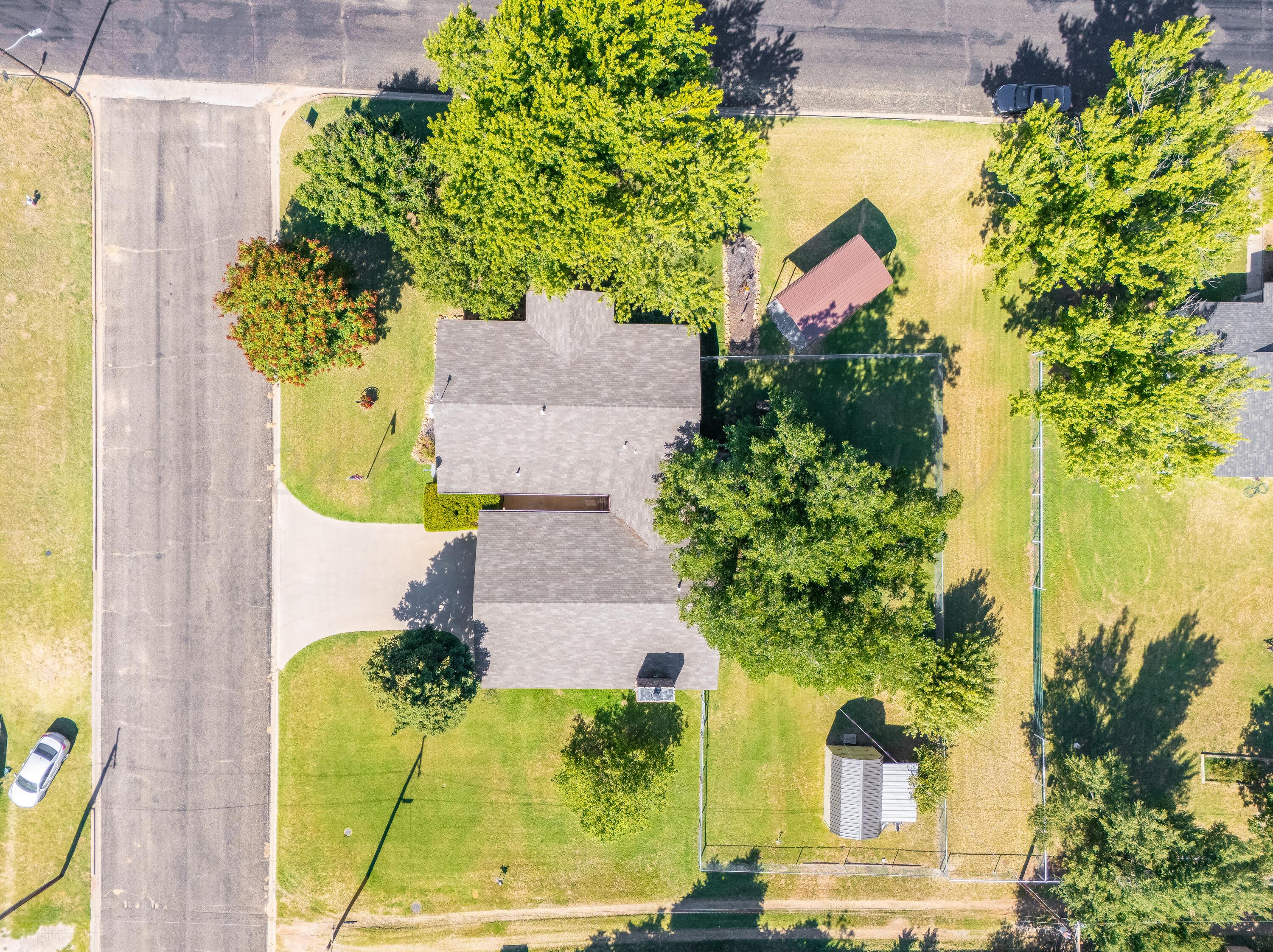 511 Cheyenne Street Wheeler, TX 79096 - Photo 45 of 45 an aerial view of a house with swimming pool