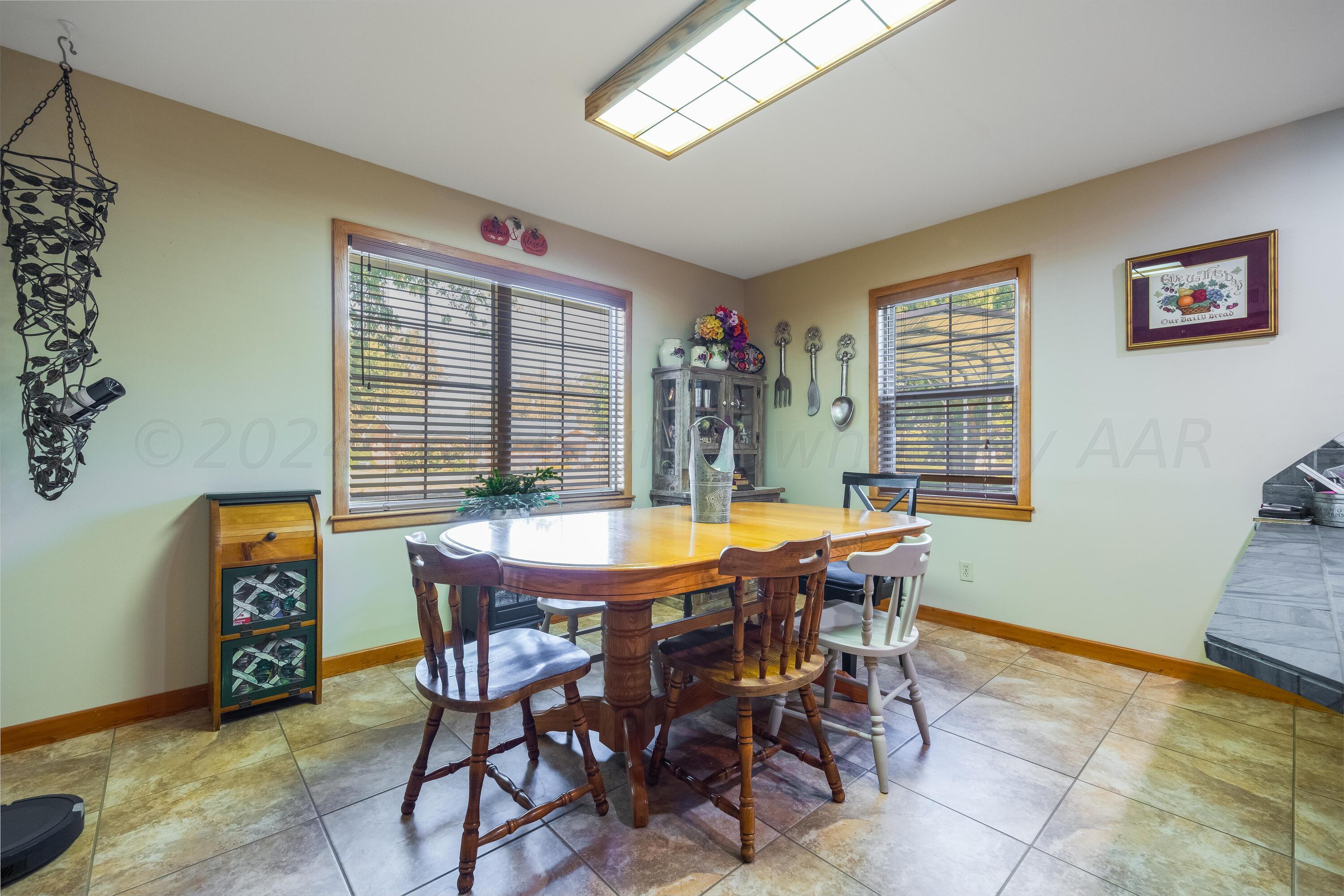 511 Cheyenne Street Wheeler, TX 79096 - Photo 7 of 45 a view of a dining room with furniture and a window