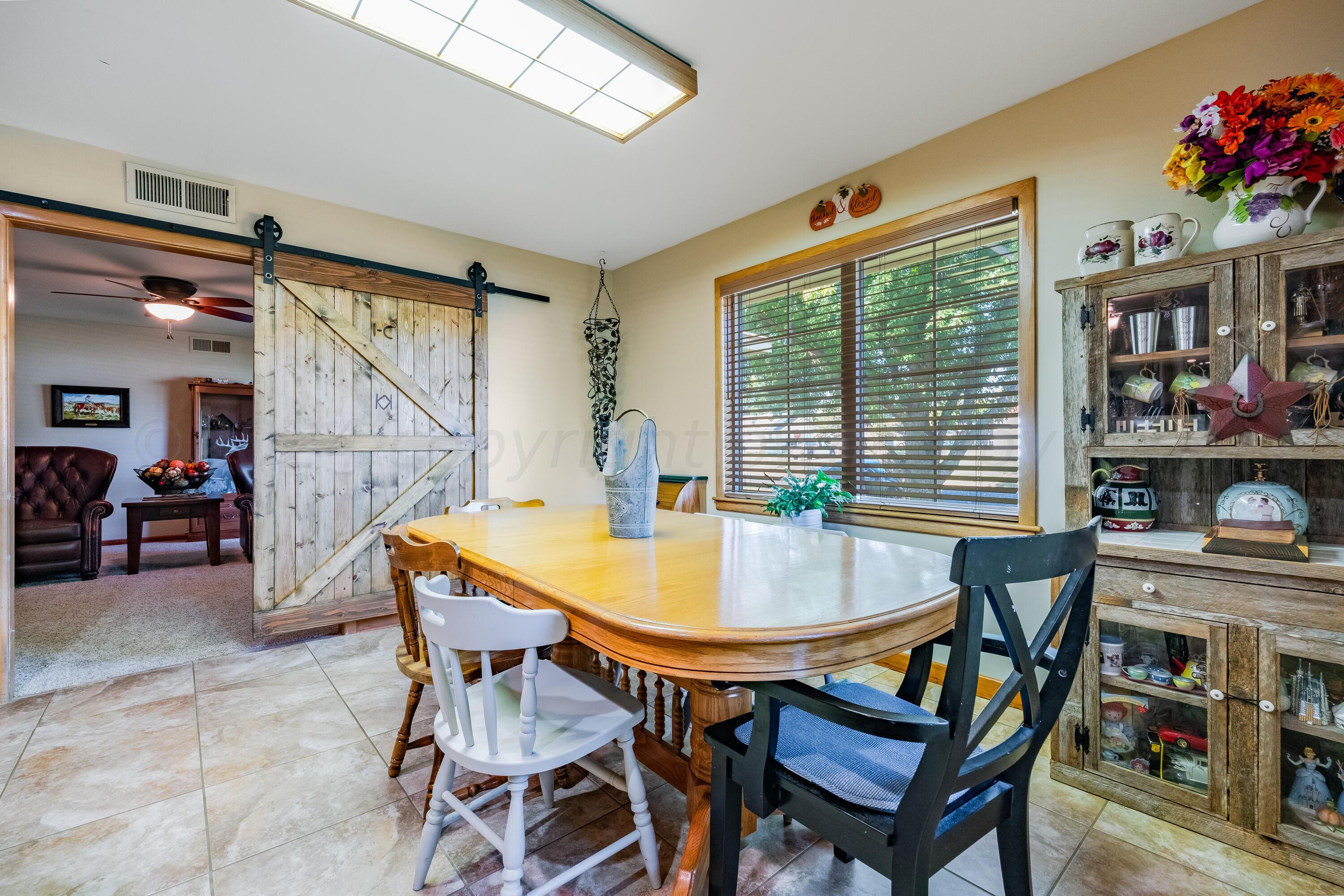 511 Cheyenne Street Wheeler, TX 79096 - Photo 8 of 45 a dining room with furniture and window