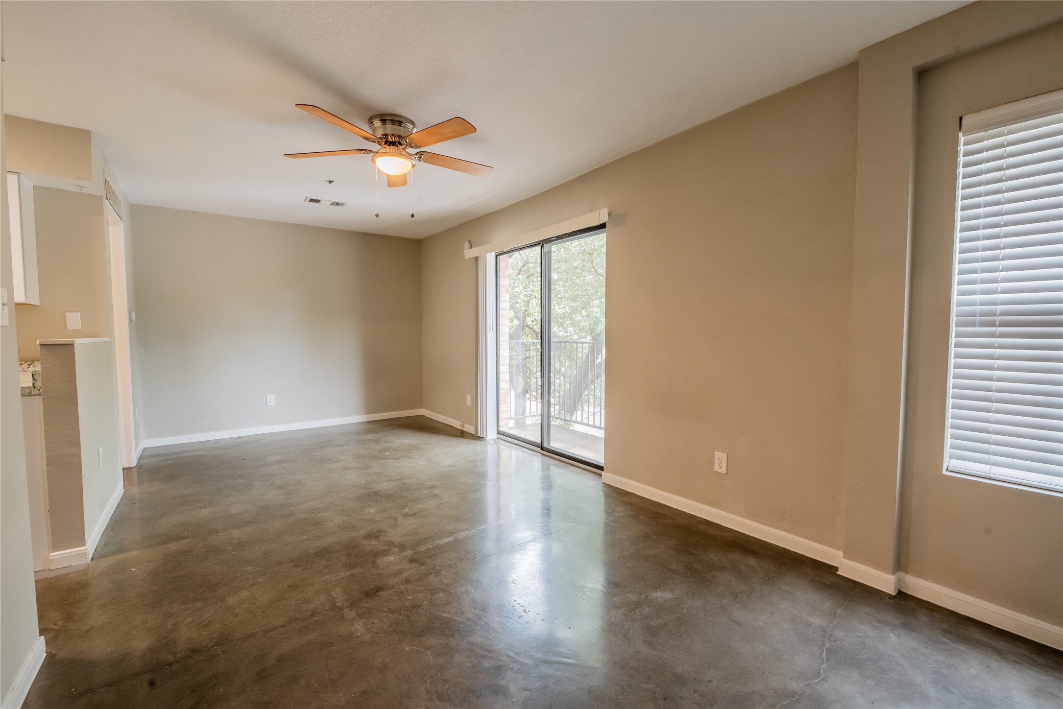 a view of an empty room with a window
