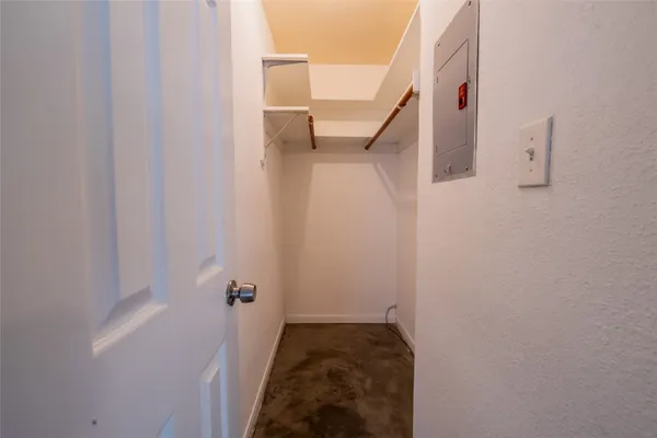 a view of a hallway with white walls