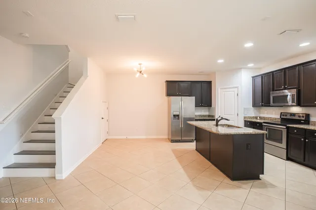 a large kitchen with cabinets