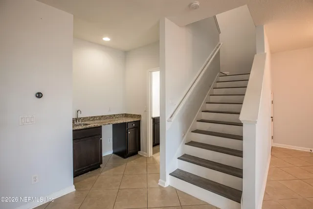 a view of a kitchen with storage and utility