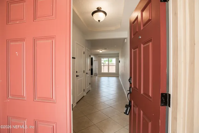a view of a hallway with windows
