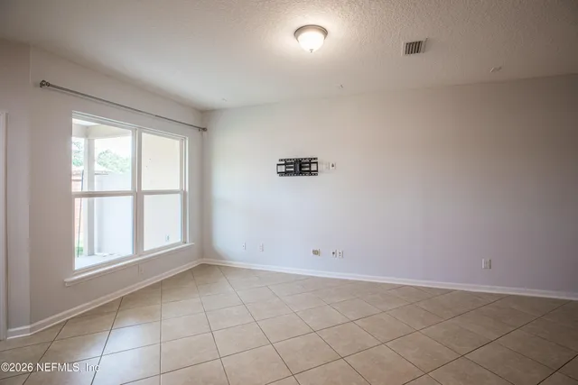 an empty room with a empty space and window