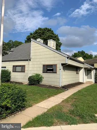 a view of a backyard of the house