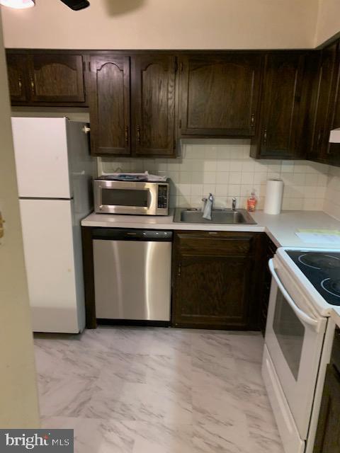 37 Chiswick Drive Lindenwold, NJ 08021 - Photo 8 of 13 a kitchen with stainless steel appliances a stove a sink and a refrigerator