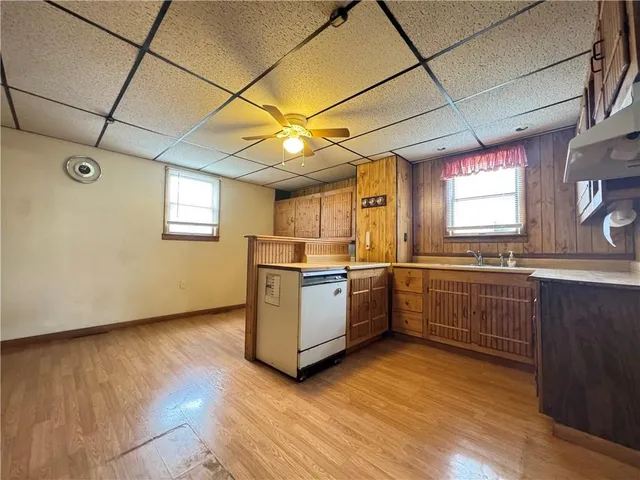 a kitchen with stove and cabinets