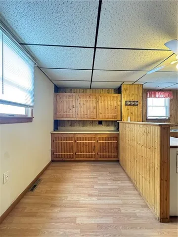a view of room with window and wooden floor