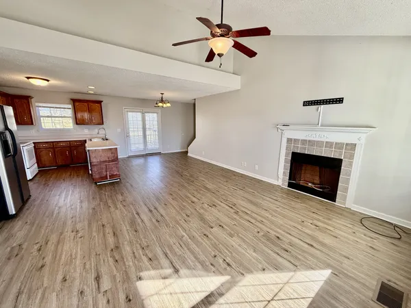 a view of a livingroom with furniture and a fireplace