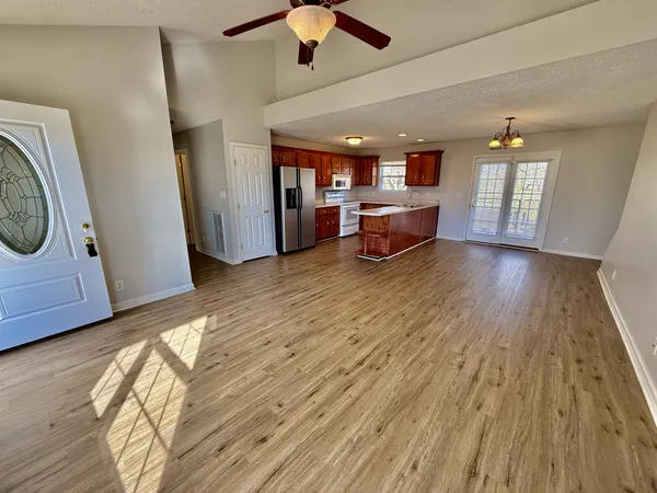 a view of a livingroom with furniture and wooden floor