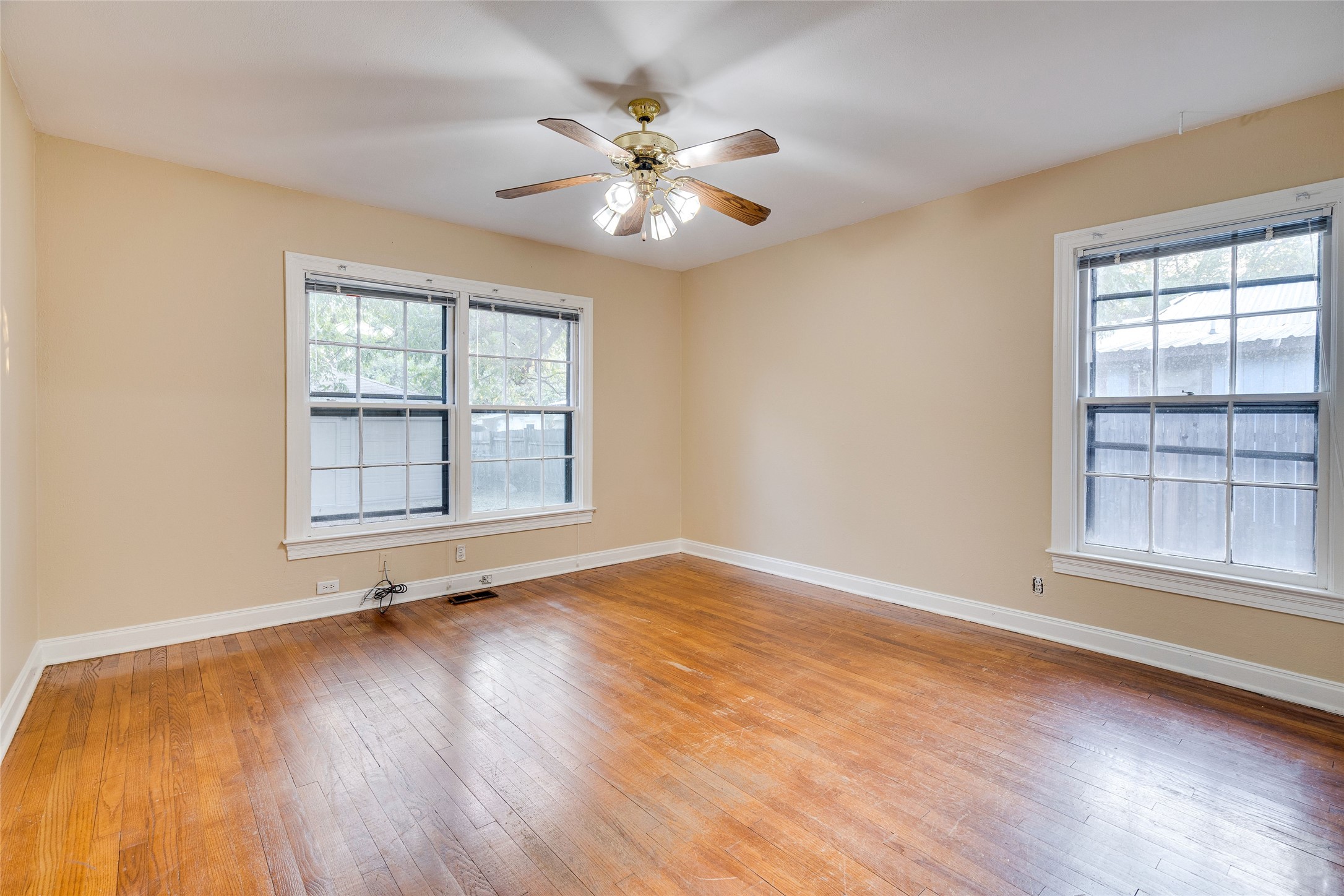1011 East 49th Street Austin, TX 78751 - Photo 17 of 35 wooden floor in an empty room with a window
