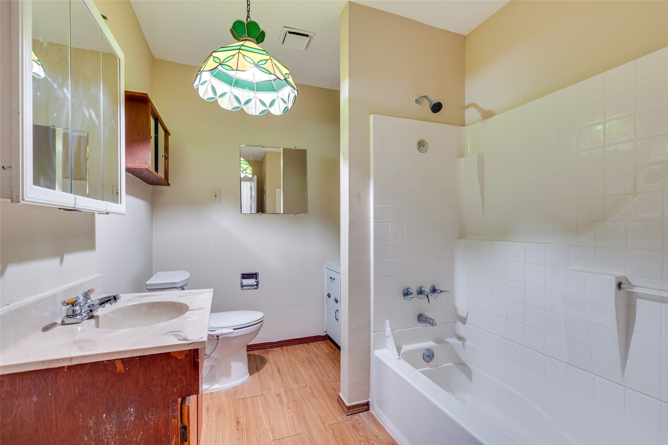 1011 East 49th Street Austin, TX 78751 - Photo 20 of 35 a bathroom with a sink a toilet and a bathtub