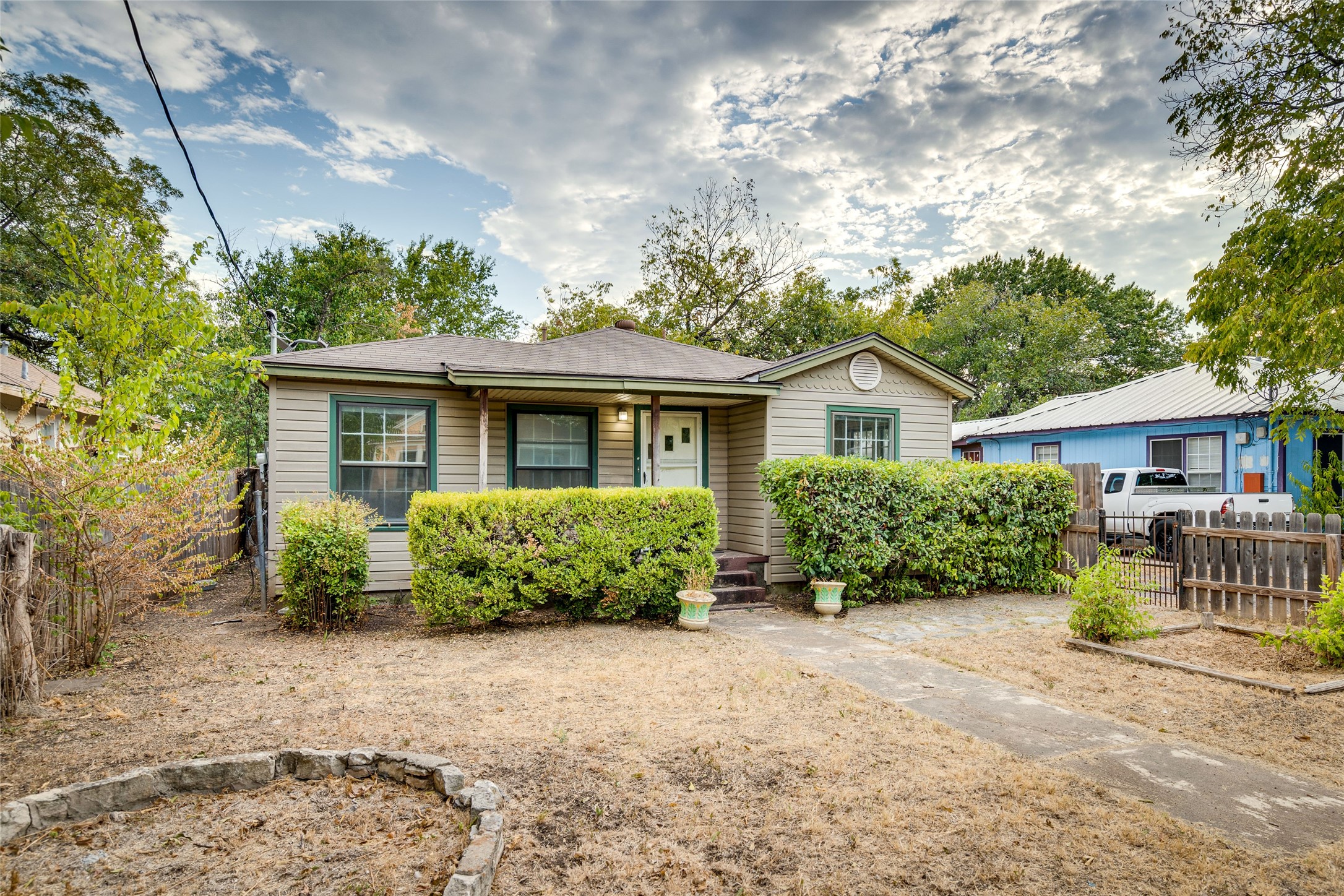 1011 East 49th Street Austin, TX 78751 - Photo 2 of 35 a front view of a house with a yard
