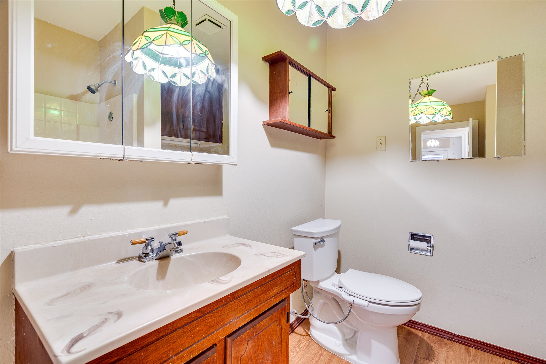1011 East 49th Street Austin, TX 78751 - Photo 21 of 35 a bathroom with a sink vanity mirror and toilet