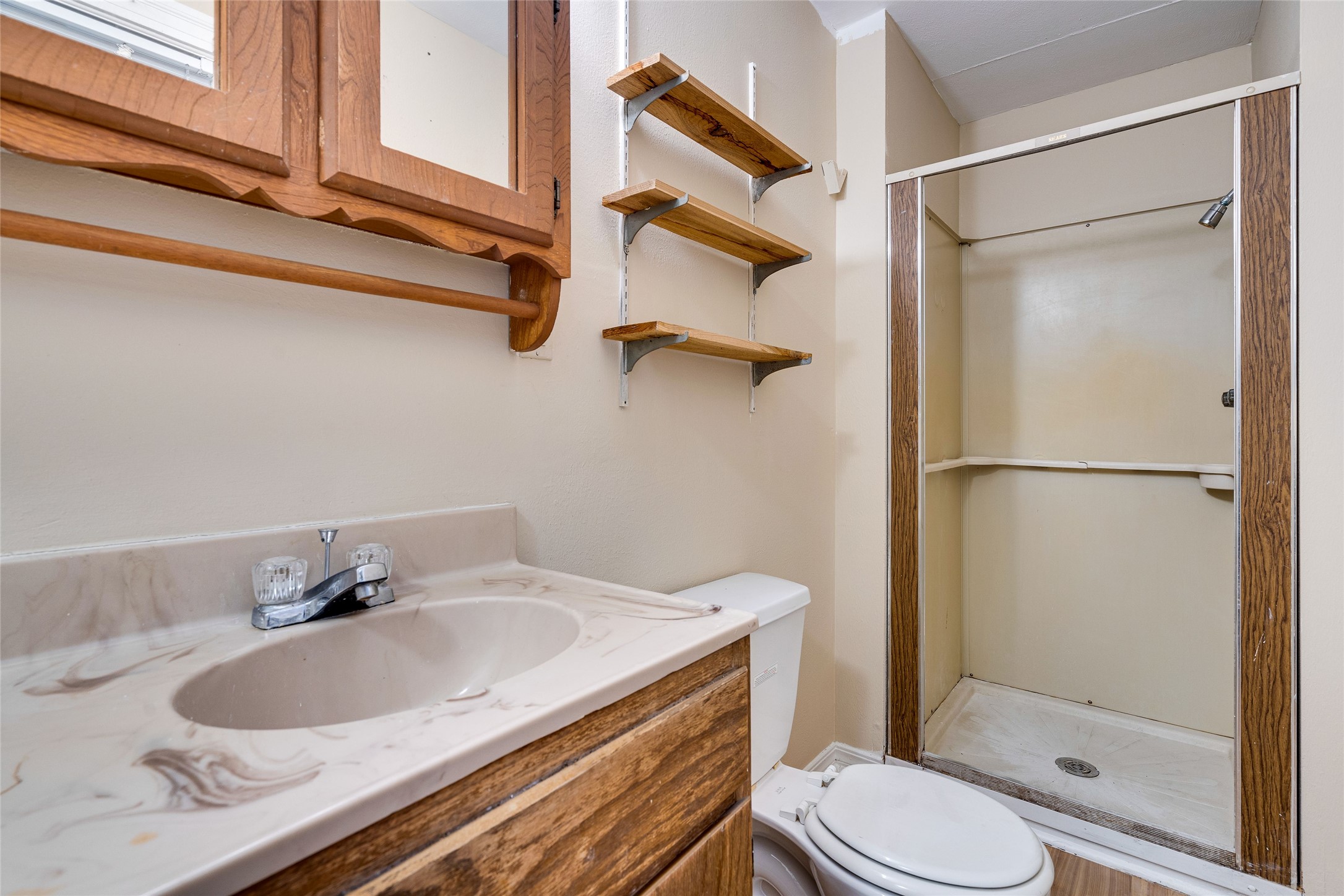 1011 East 49th Street Austin, TX 78751 - Photo 25 of 35 a bathroom with a sink toilet and shower