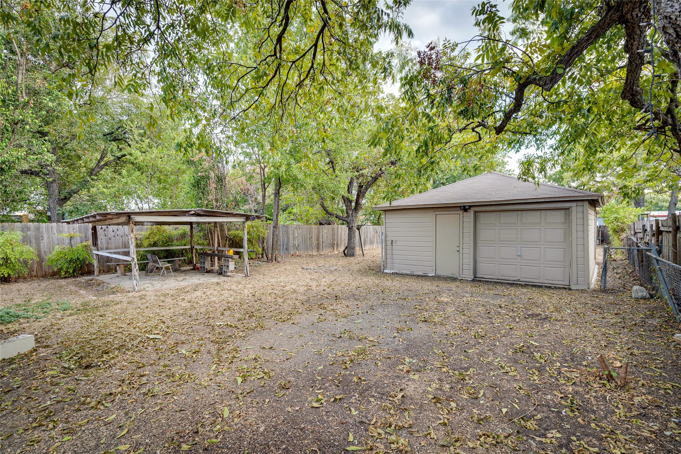 1011 East 49th Street Austin, TX 78751 - Photo 27 of 35 a view of a house with backyard and a tree