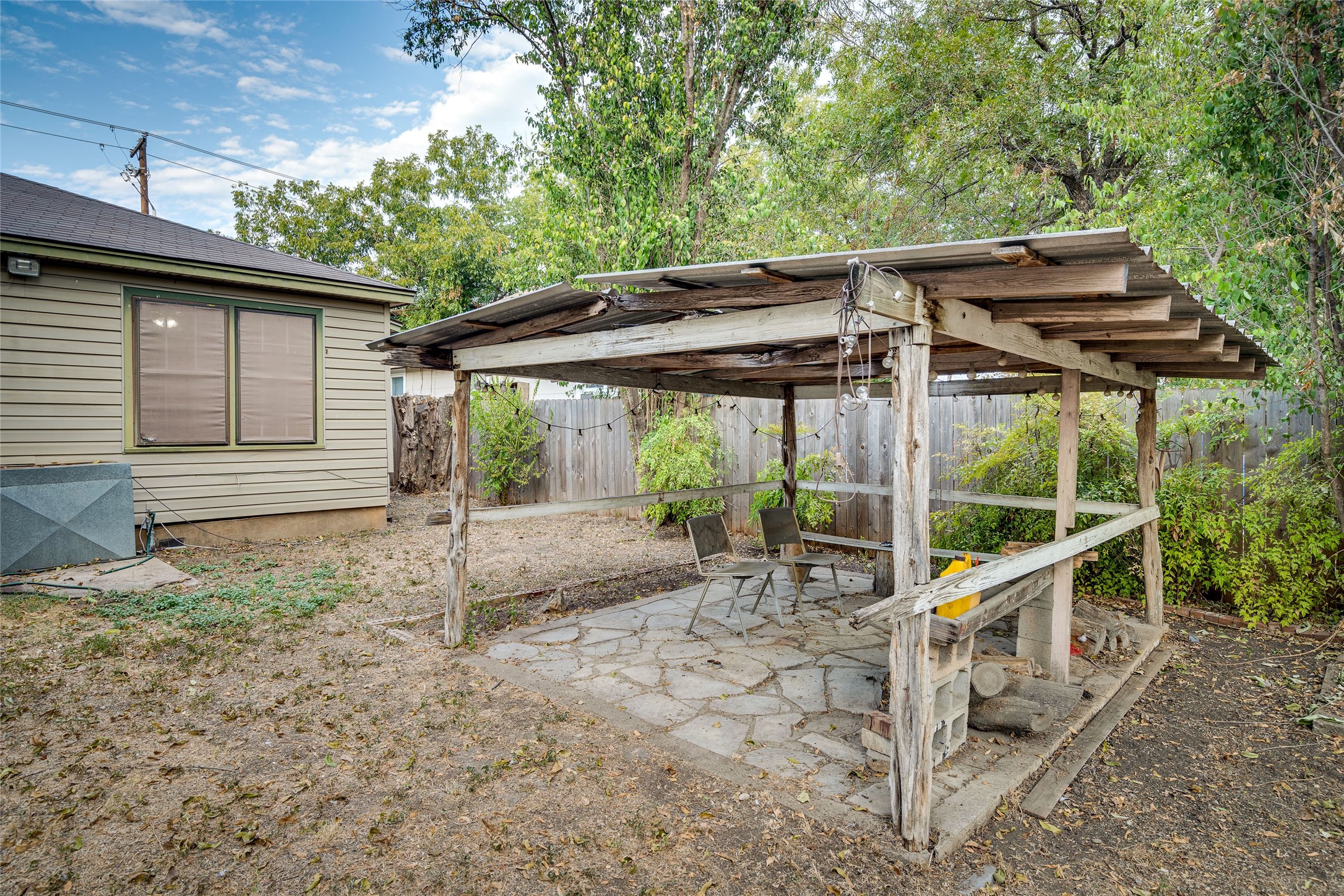 1011 East 49th Street Austin, TX 78751 - Photo 35 of 35 a view of a house with backyard and chairs