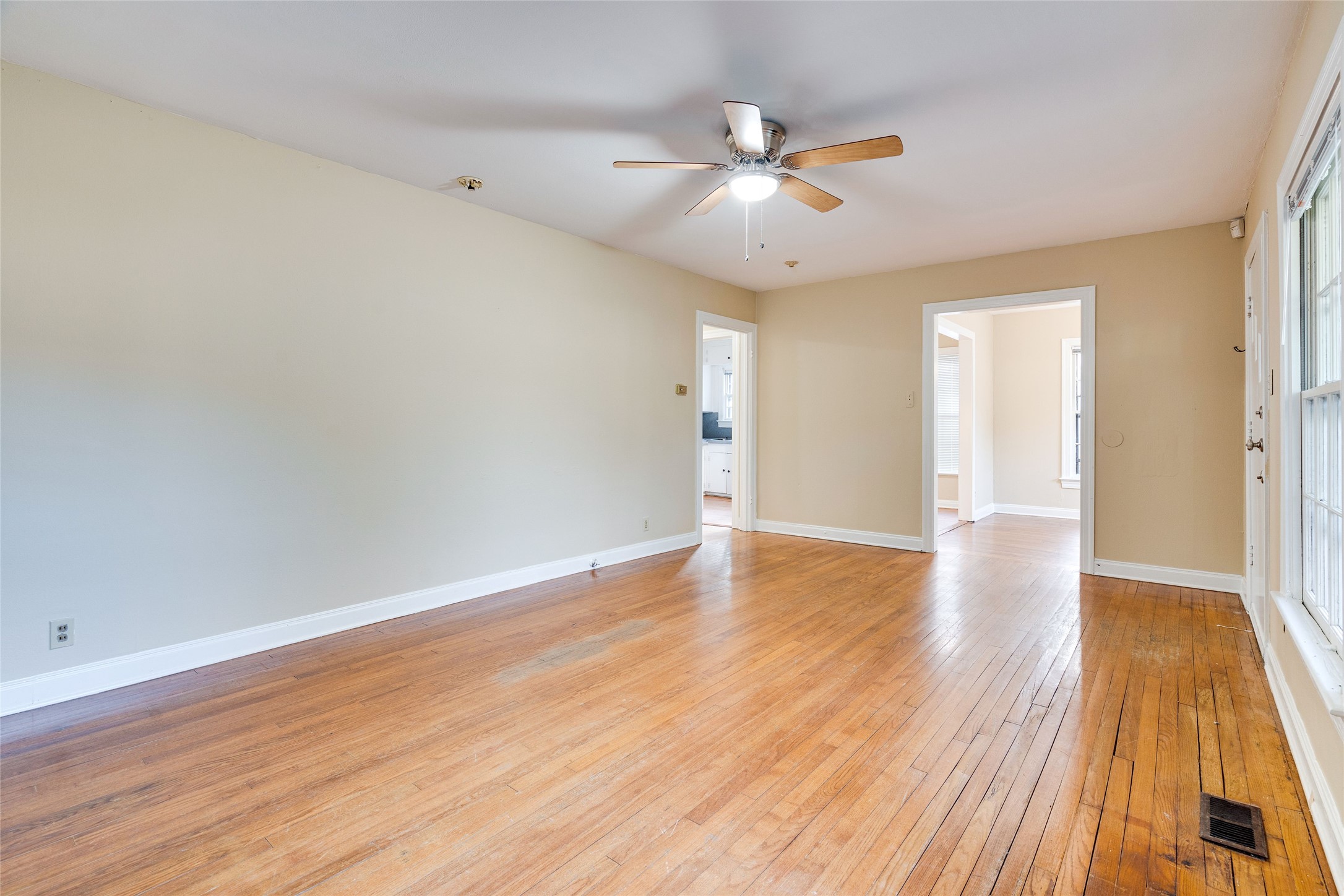 1011 East 49th Street Austin, TX 78751 - Photo 4 of 35 wooden floor in an empty room with a window
