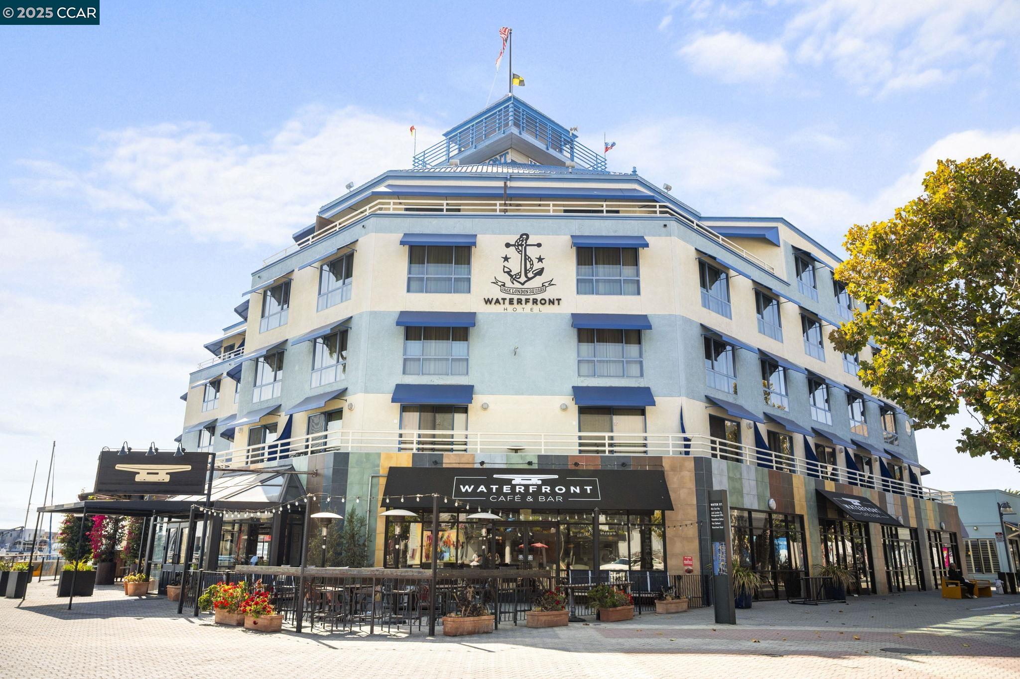 814 20th Street Oakland, CA 94607 - Photo 19 of 27 a front view of a building with street view and trees