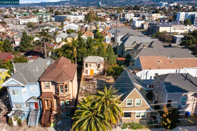 an aerial view of a residential apartment building with a yard