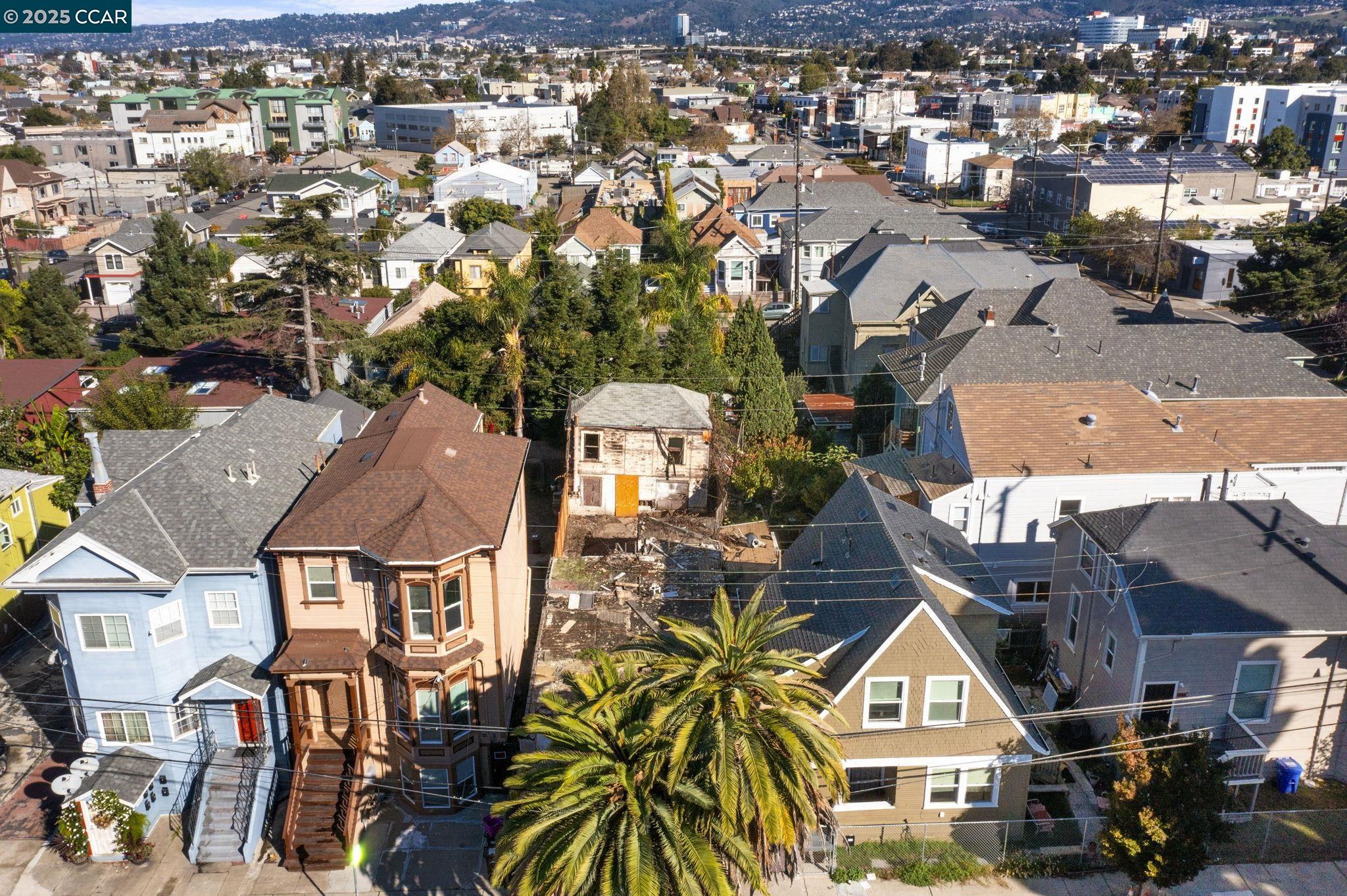 814 20th Street Oakland, CA 94607 - Photo 4 of 27 an aerial view of a residential apartment building with a yard