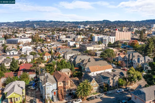 an aerial view of residential building with green space