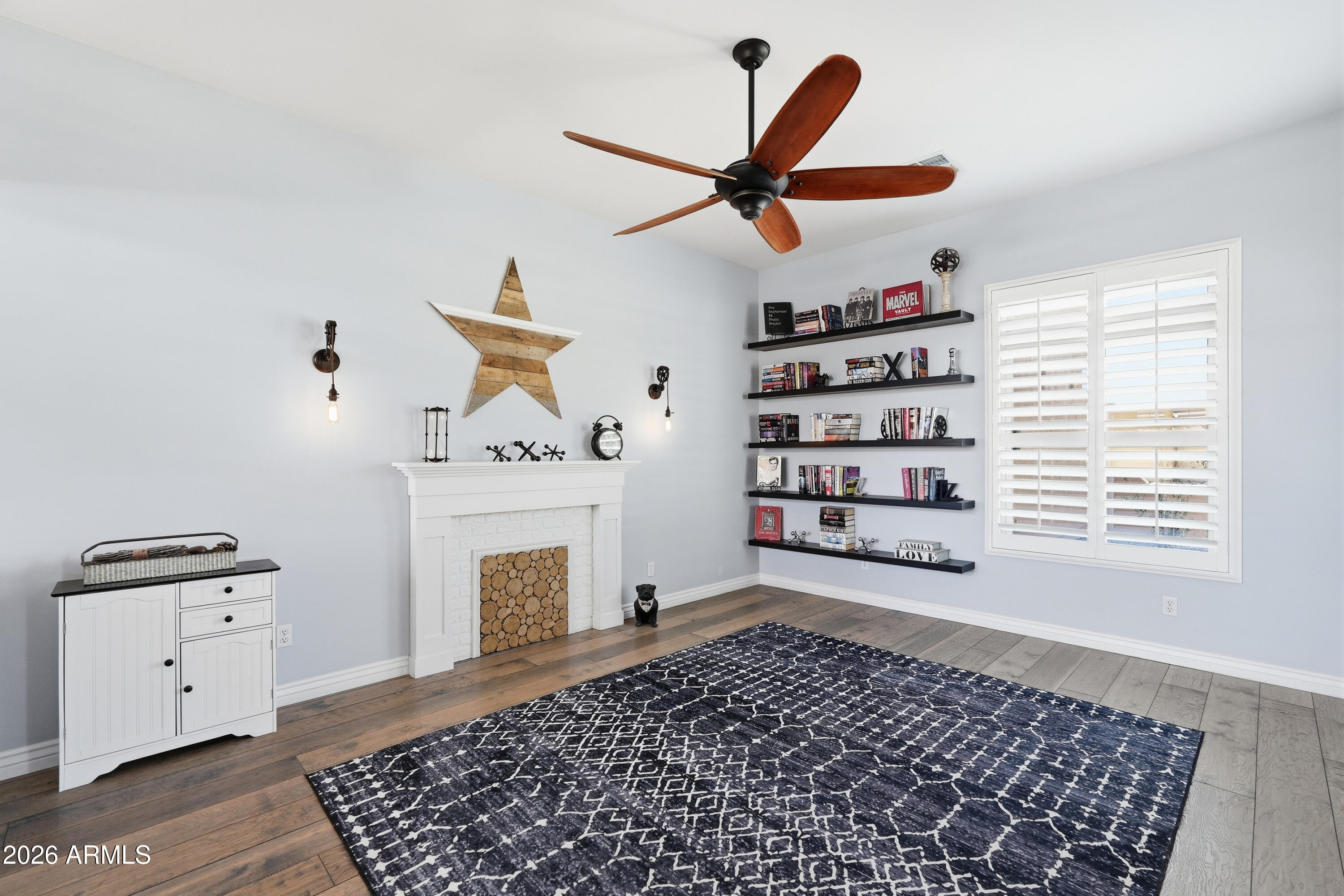 2616 West Canyon Road Phoenix, AZ 85086 - Photo 15 of 45 a very nice looking room with a ceiling fan and a rug
