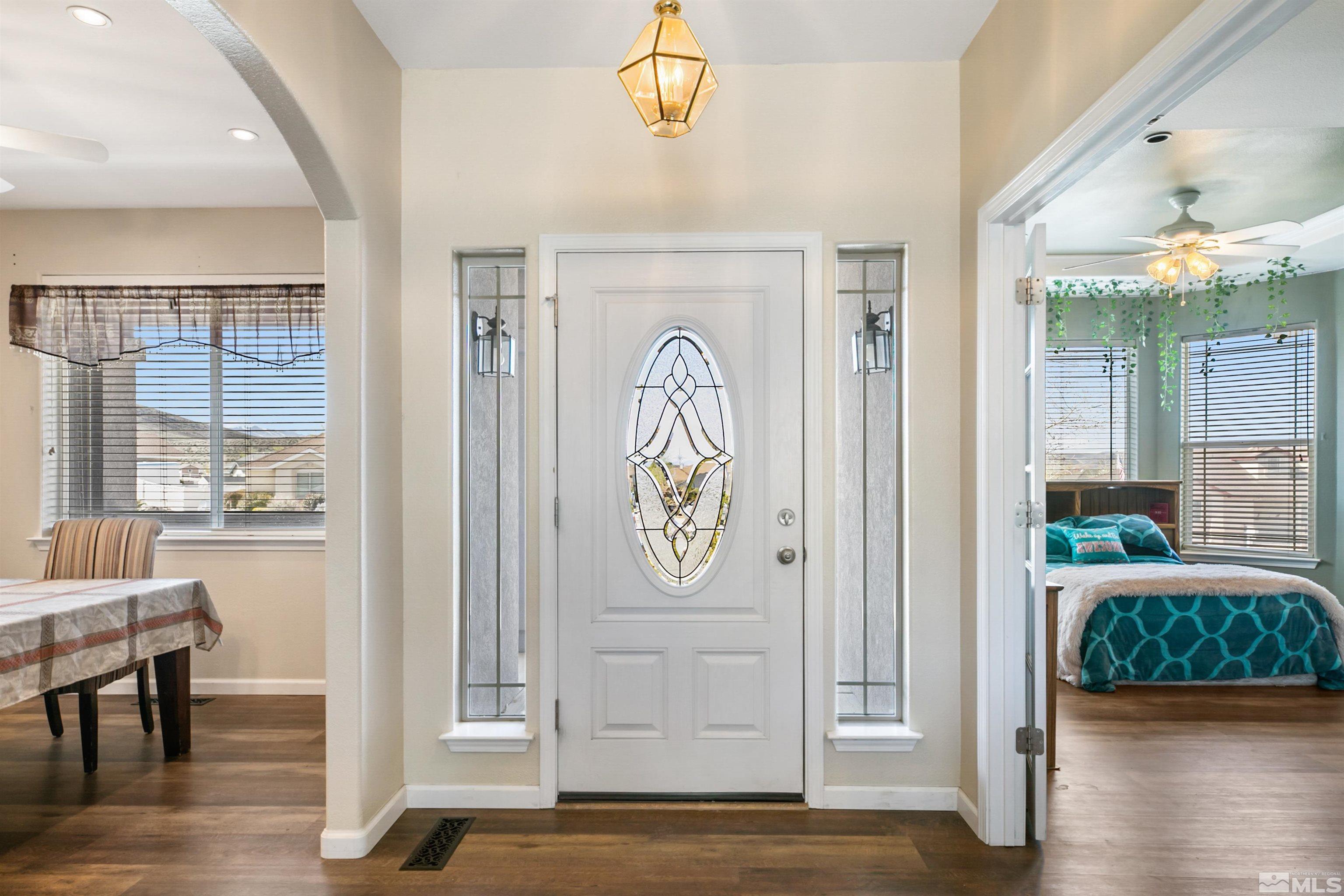 1095 Sage Street Fernley, NV 89408 - Photo 11 of 37 a view of front door with entryway and wooden floor