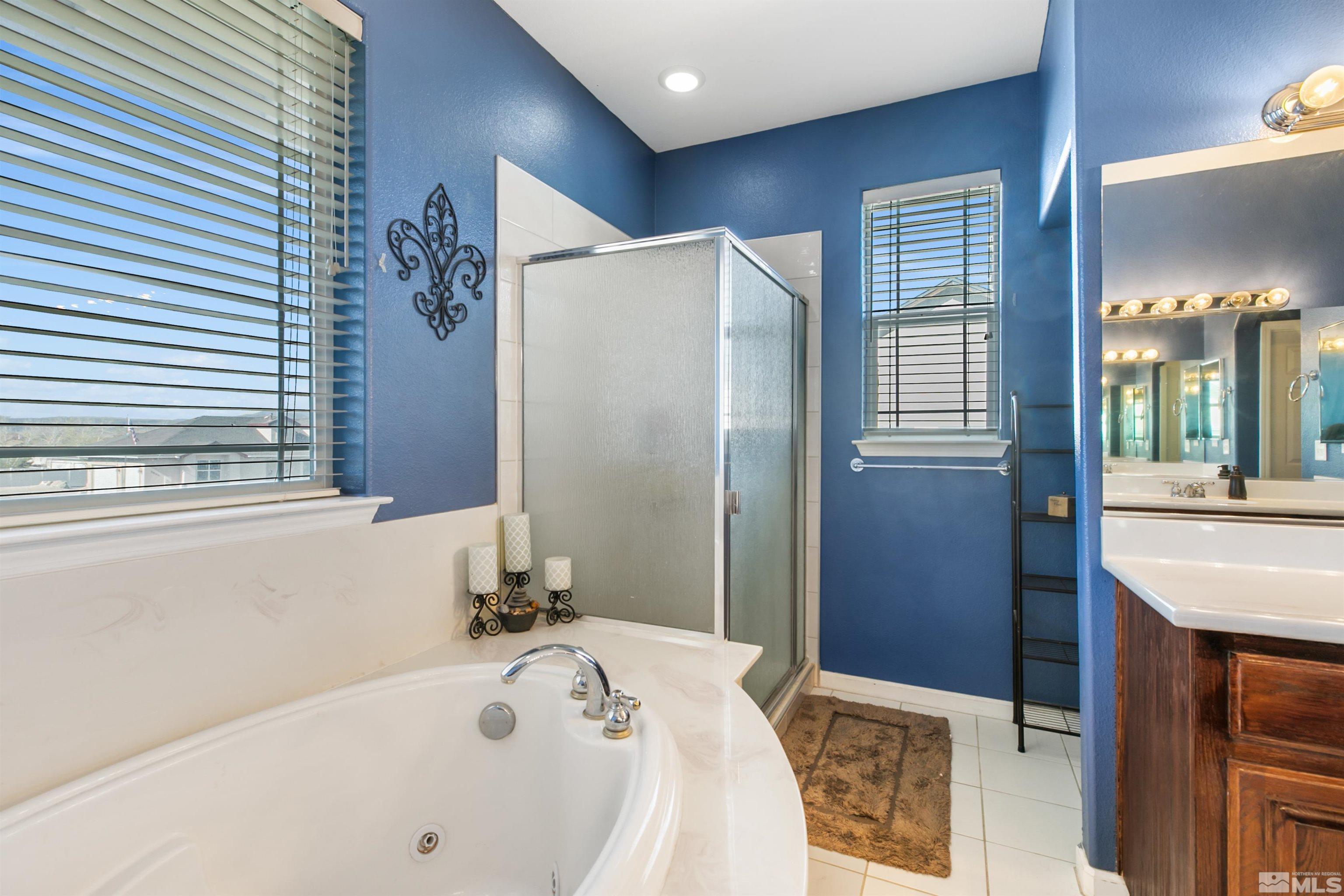 1095 Sage Street Fernley, NV 89408 - Photo 19 of 37 a bathroom with a tub and a sink