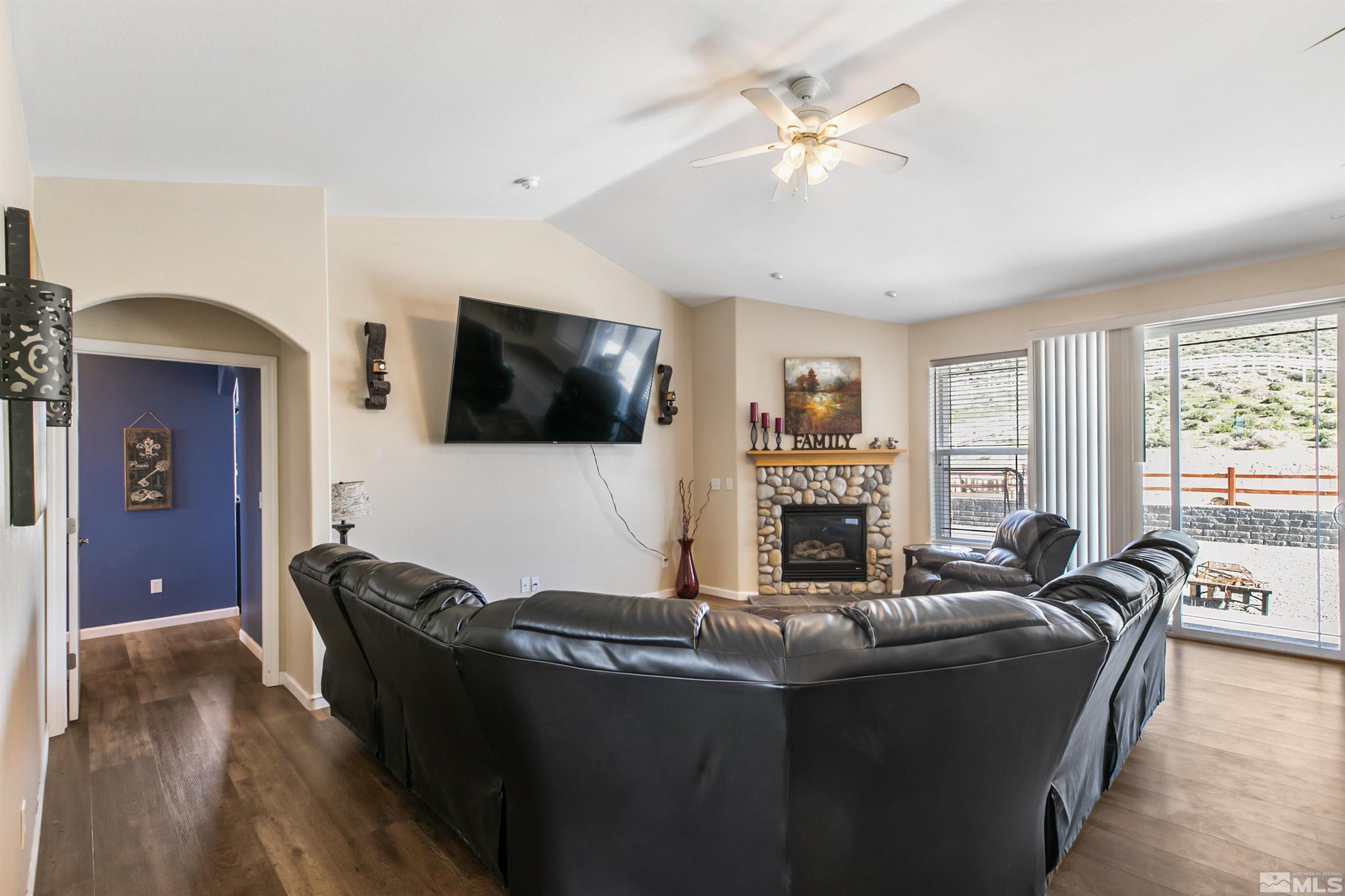 1095 Sage Street Fernley, NV 89408 - Photo 21 of 37 a living room with furniture and a flat screen tv