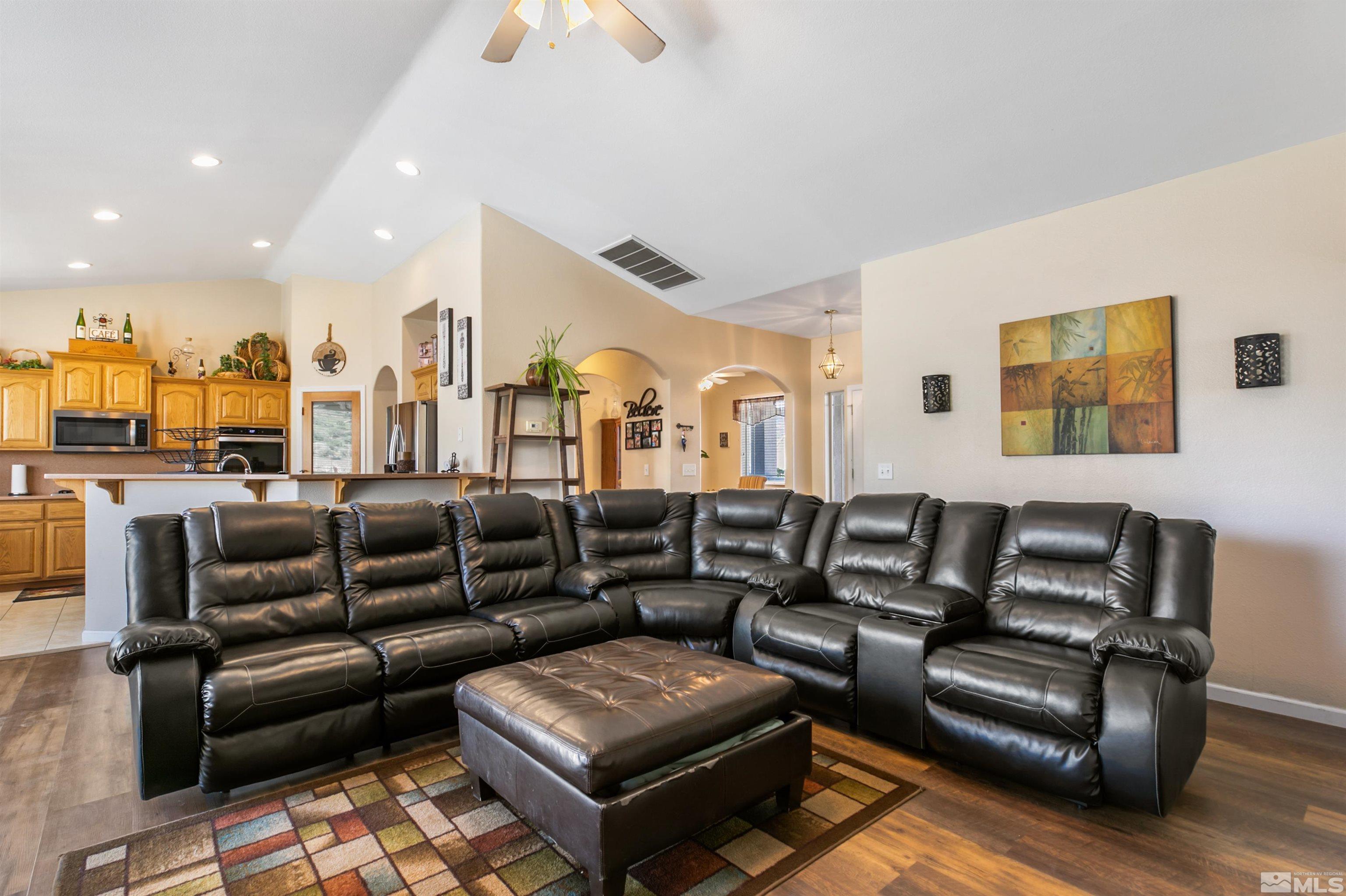 1095 Sage Street Fernley, NV 89408 - Photo 24 of 37 a living room with furniture and a flat screen tv