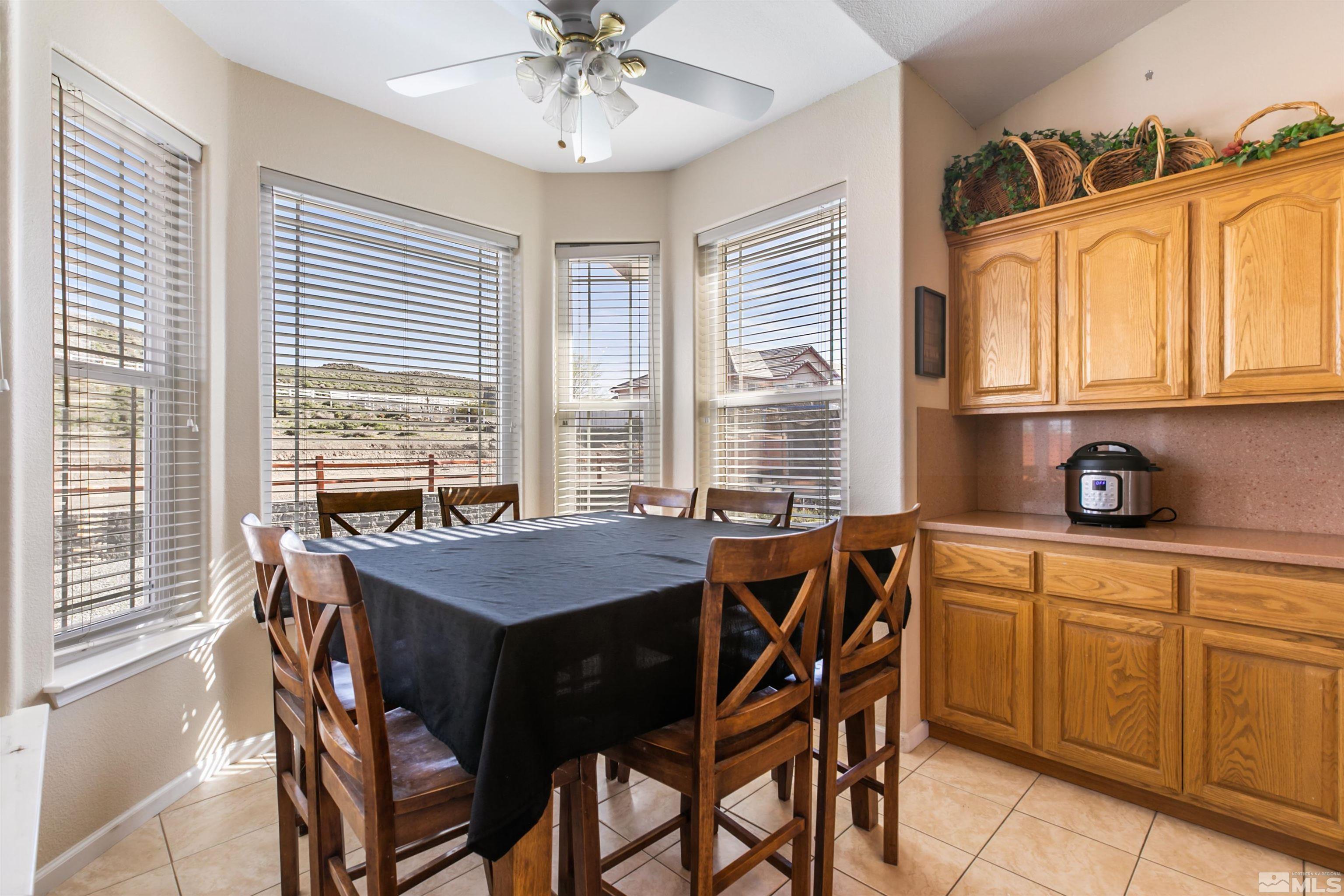 1095 Sage Street Fernley, NV 89408 - Photo 30 of 37 a dining room with furniture and window