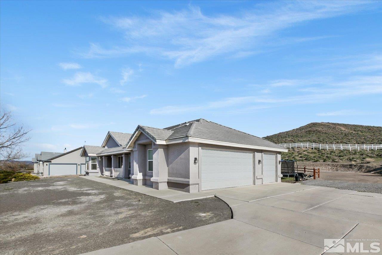 1095 Sage Street Fernley, NV 89408 - Photo 3 of 37 a view of a house with a outdoor space