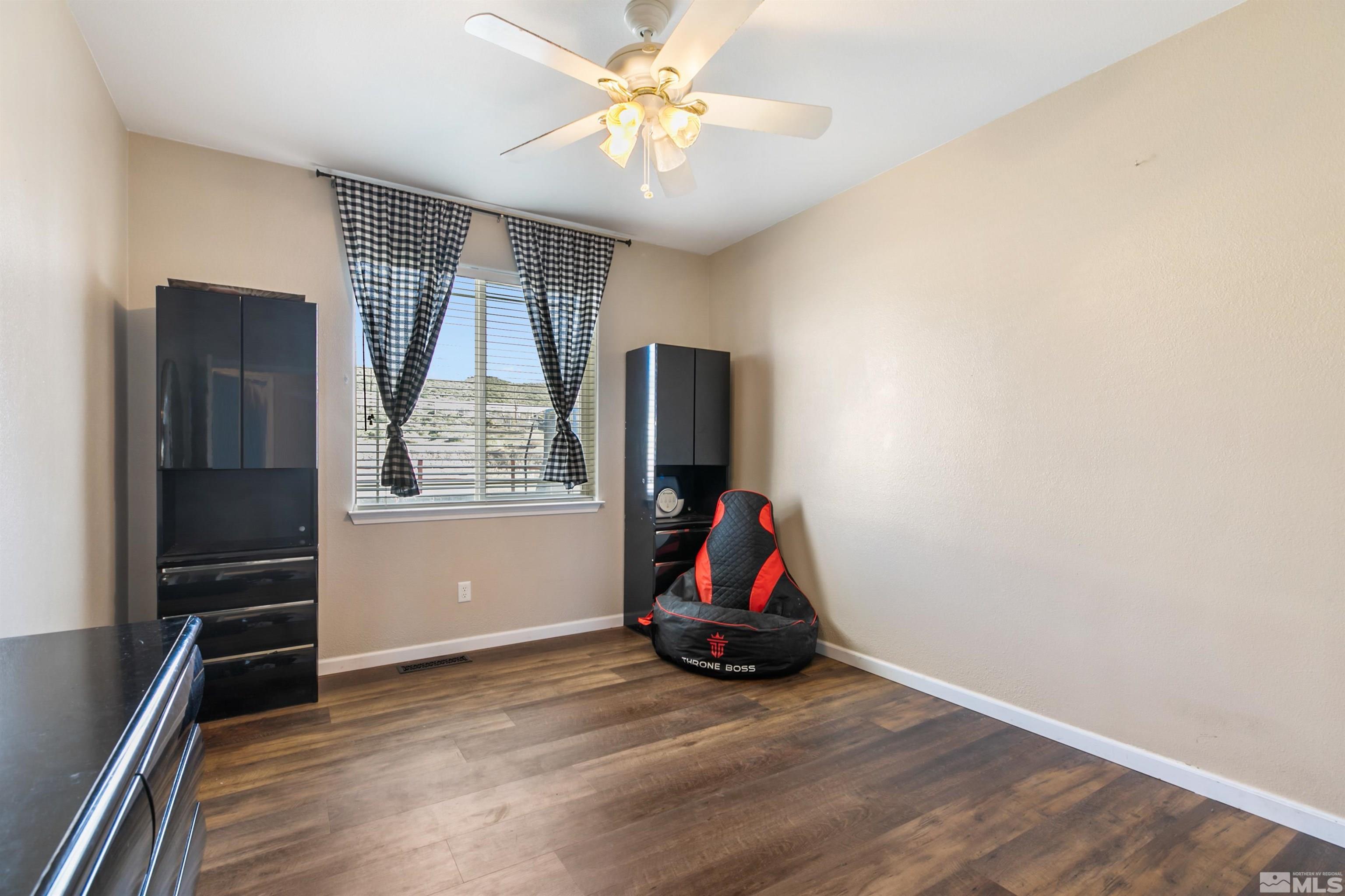 1095 Sage Street Fernley, NV 89408 - Photo 31 of 37 a view of a livingroom with furniture and a ceiling fan