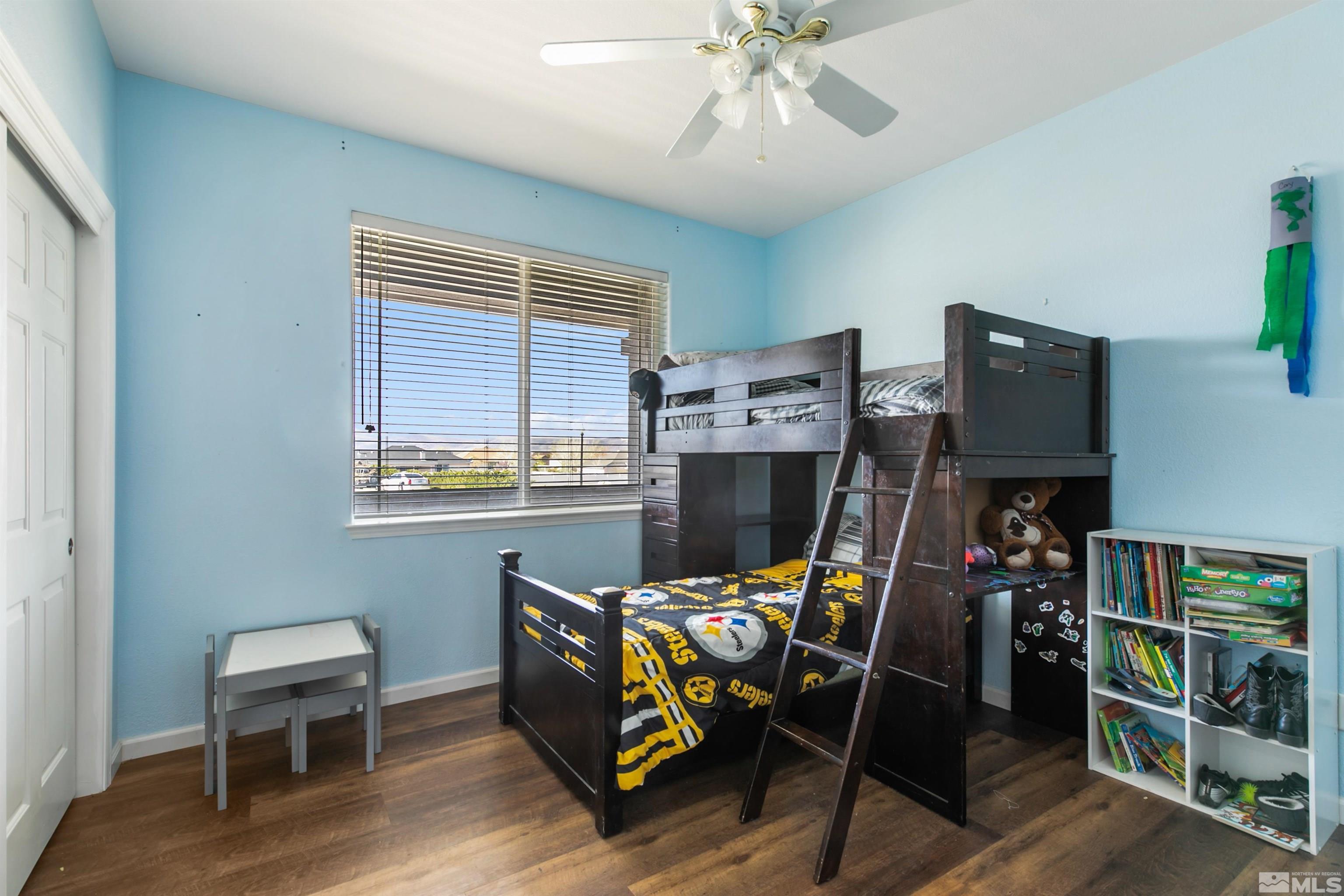 1095 Sage Street Fernley, NV 89408 - Photo 35 of 37 a workspace with furniture and wooden floor