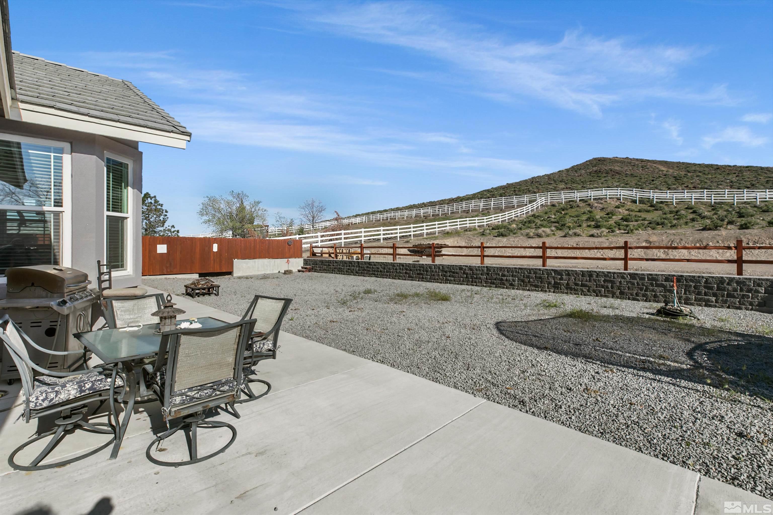 1095 Sage Street Fernley, NV 89408 - Photo 6 of 37 a view of a patio with a table and chairs