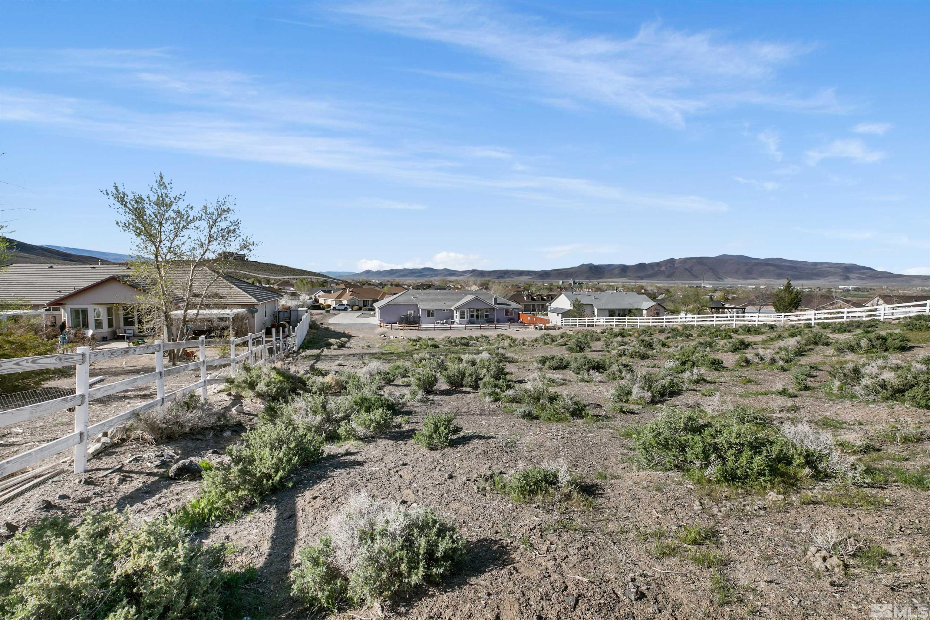 1095 Sage Street Fernley, NV 89408 - Photo 9 of 37 a view of a house with a mountain