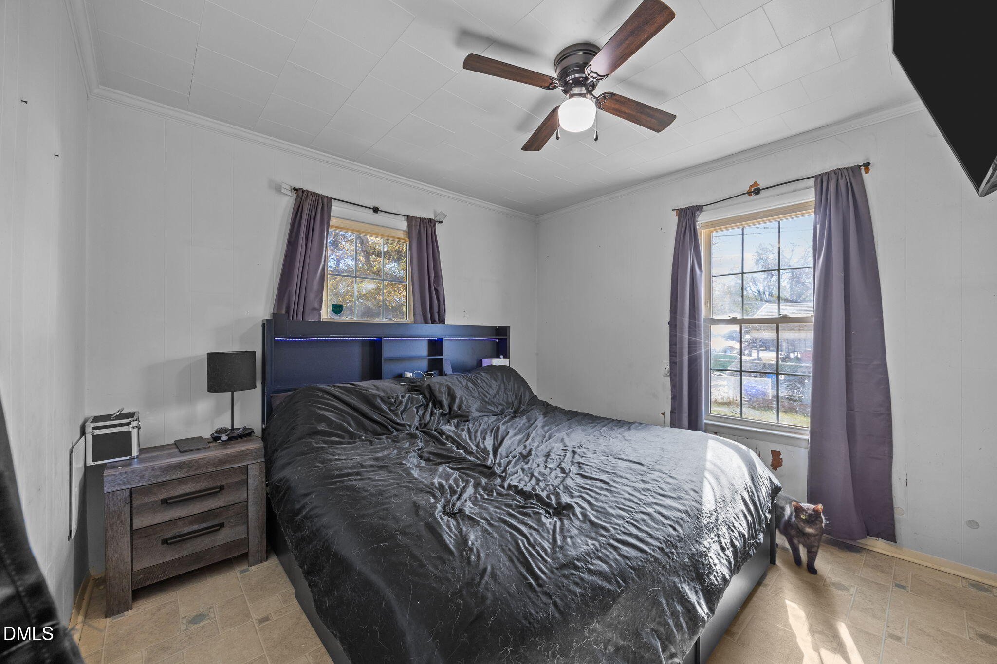 1713 Lower Hopedale Road Burlington, NC 27217 - Photo 7 of 13 a bedroom with a bed dresser and a window