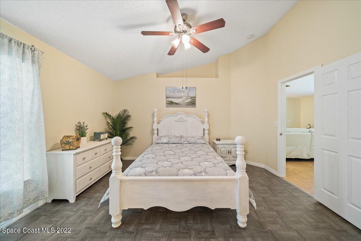 2177 Redwood Circle Palm Bay, FL 32905 - Photo 13 of 30 a living room with a bed and furniture